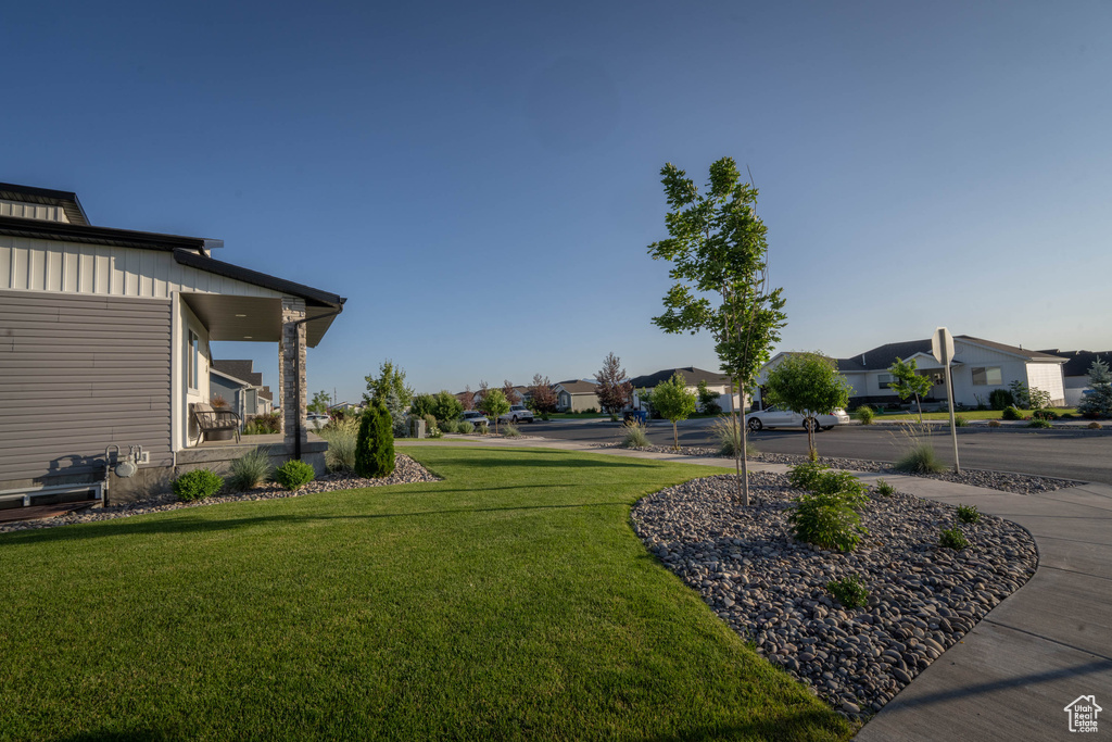 View of grassy yard featuring a residential view