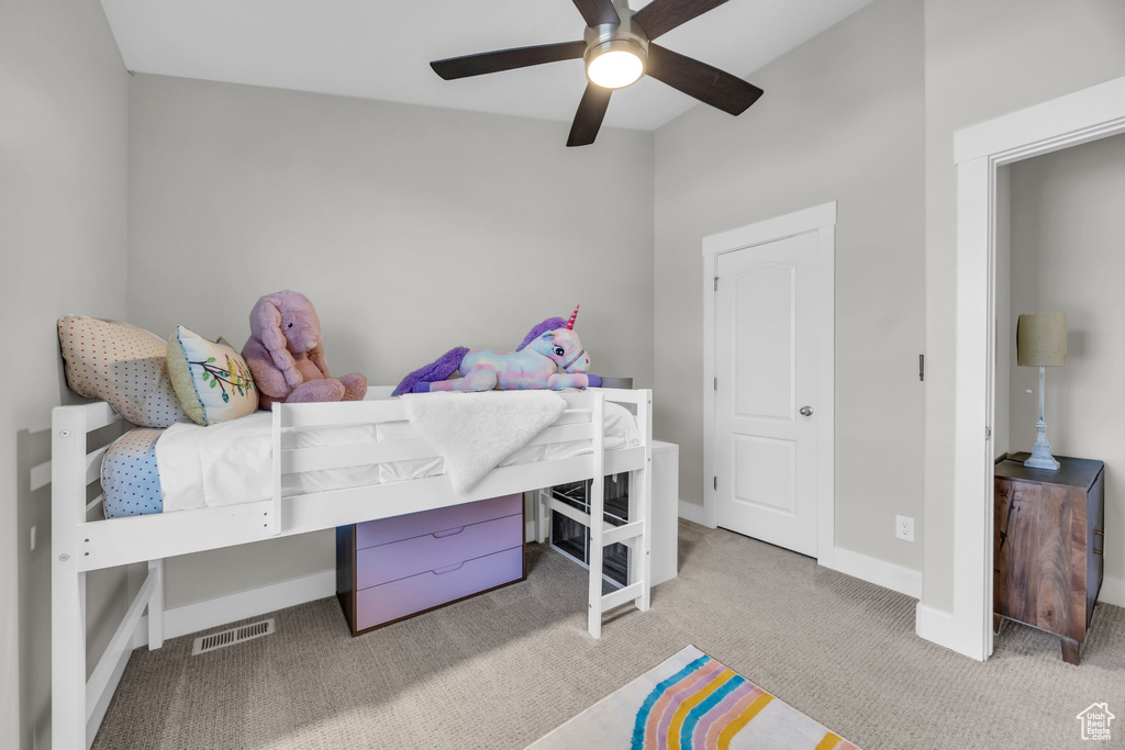 Bedroom with carpet and a ceiling fan