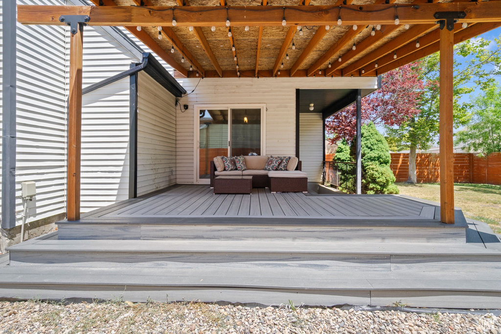 Wooden terrace featuring an outdoor hangout area