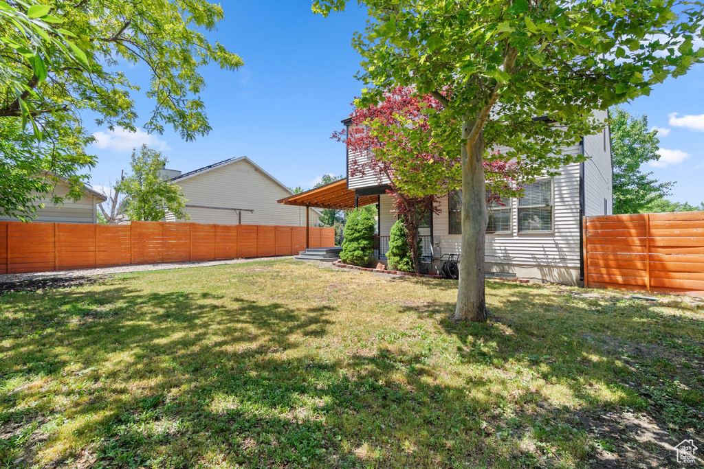 View of fenced backyard