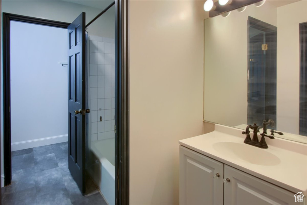 Full bathroom featuring vanity and  shower combination