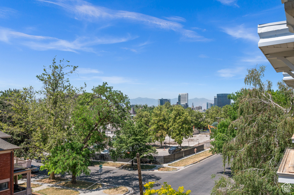 Exterior space with a city view and a mountain view