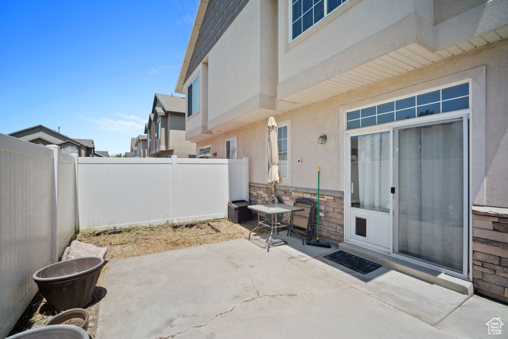 Fenced backyard with a patio area