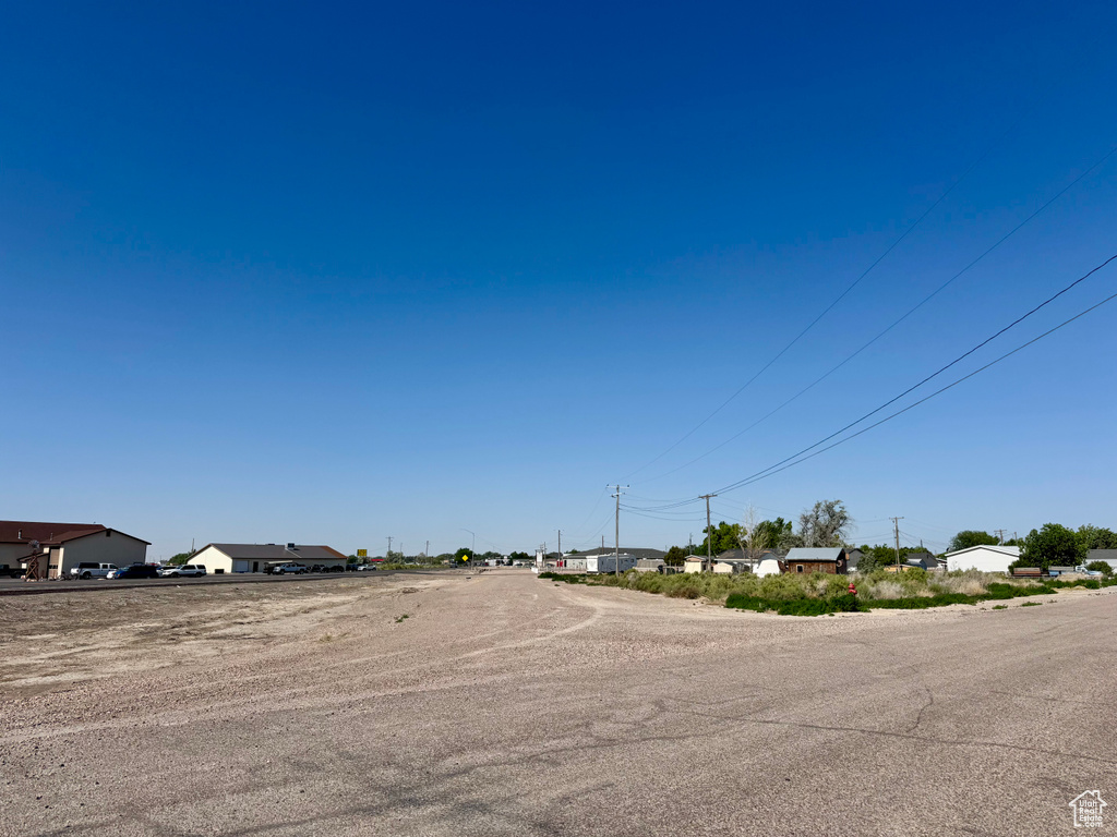 View of asphalt street featuring a residential view