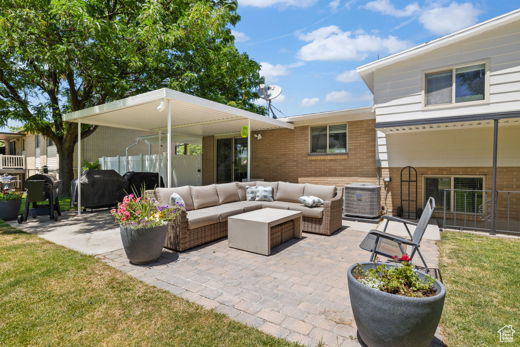 View of patio / terrace with an outdoor hangout area and a grill