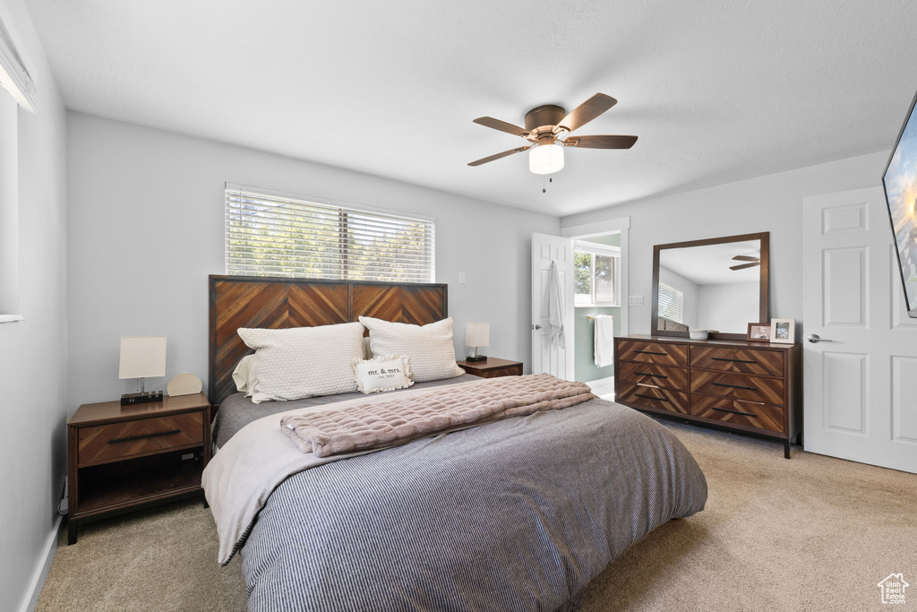 Bedroom with light carpet and ceiling fan