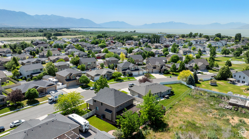 Aerial view of residential area featuring mountains