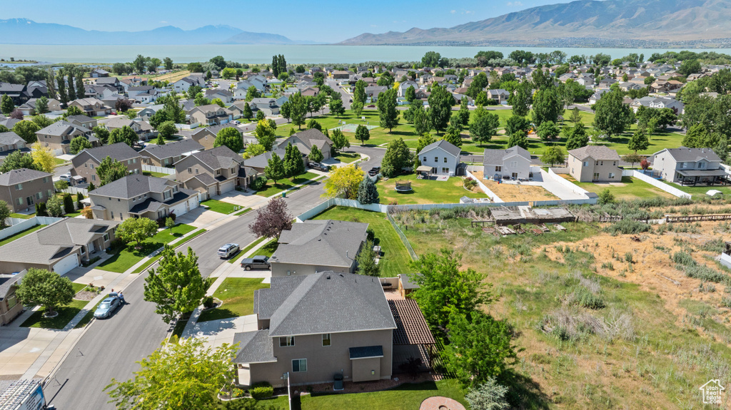 Aerial perspective of suburban area featuring a water and mountain view