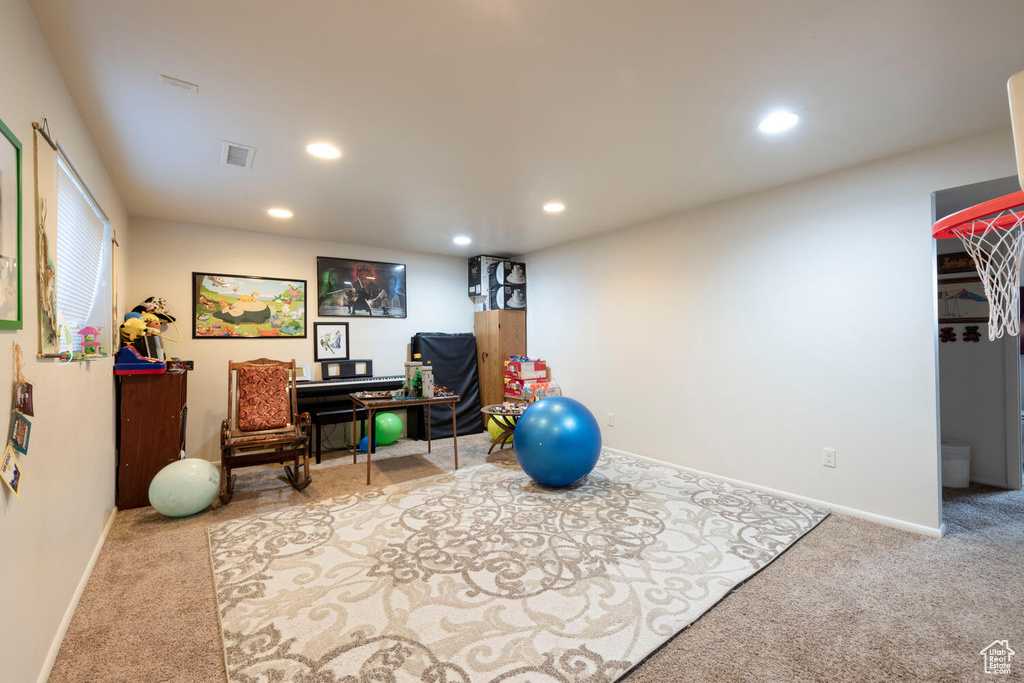Workout area with carpet and recessed lighting
