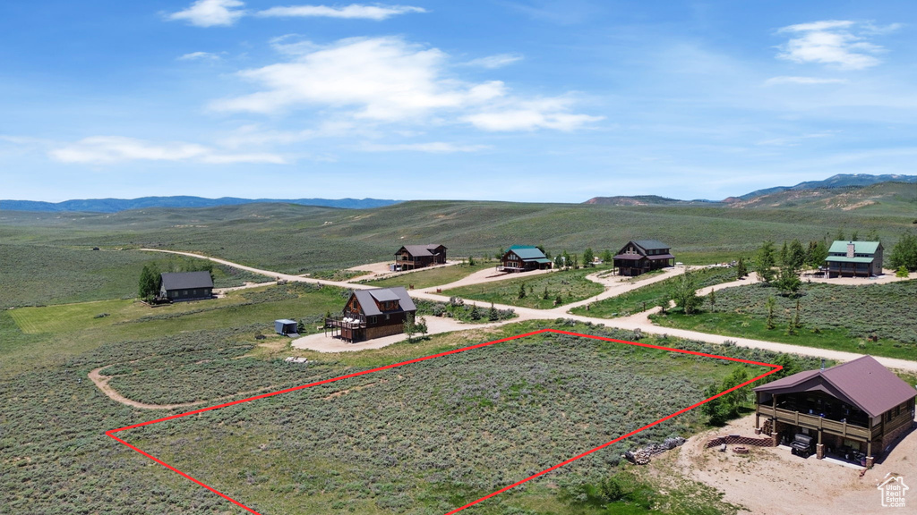 Overview of rural landscape with property boundaries highlighted and mountains