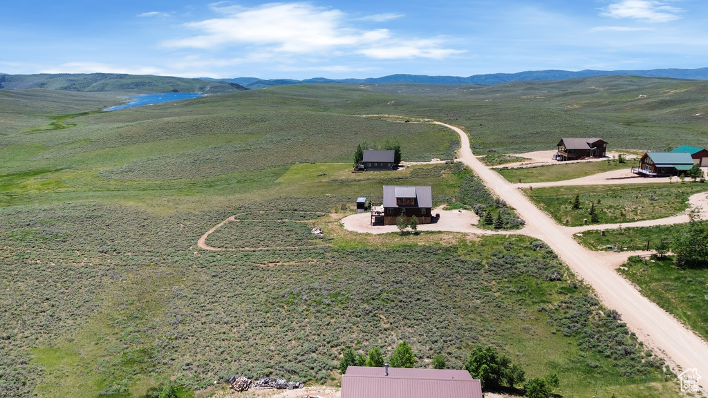 Aerial view of sparsely populated area with a mountainous background