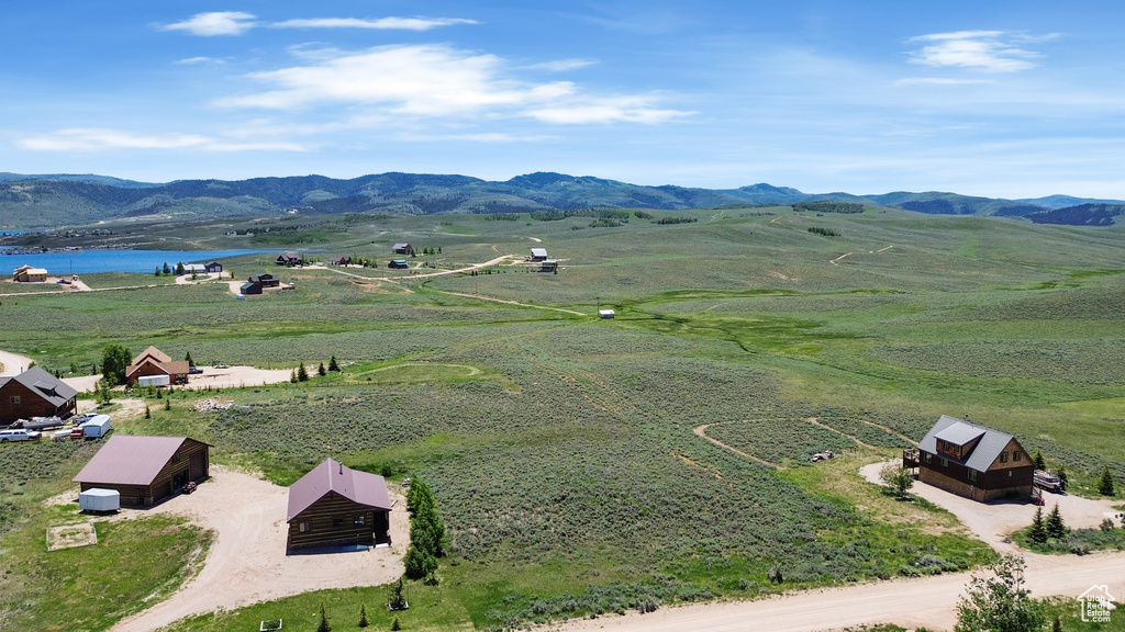 Mountain view featuring a nearby body of water and rural landscape