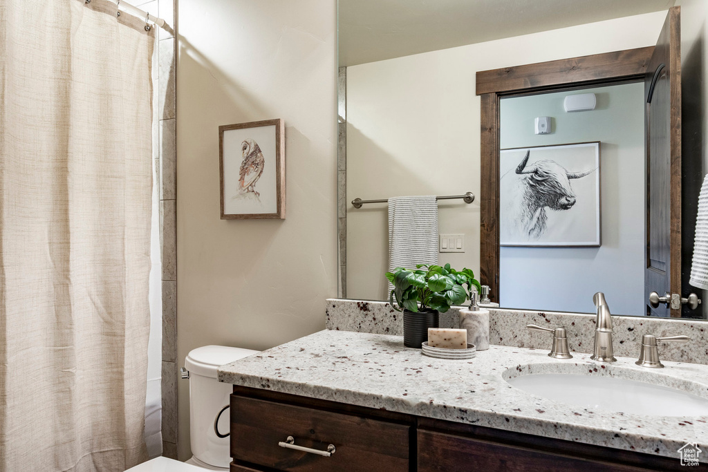 Full bathroom featuring vanity and shower / tub combo with curtain