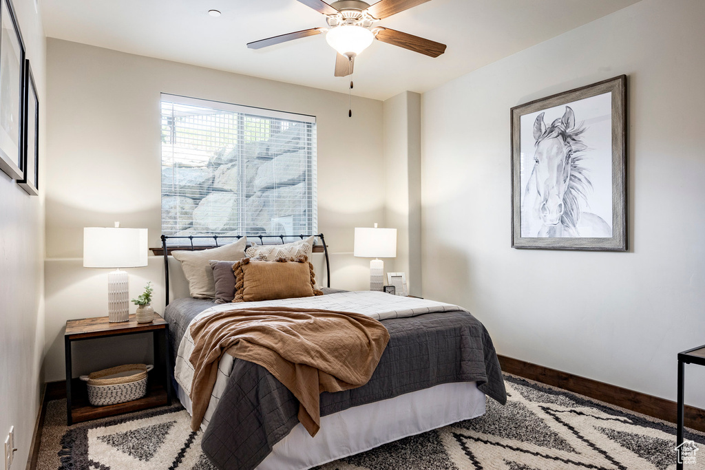 Bedroom featuring baseboards and a ceiling fan