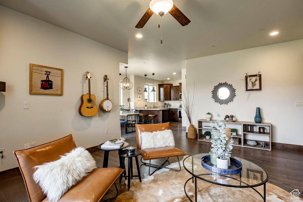 Living room featuring a ceiling fan, wood finished floors, and recessed lighting