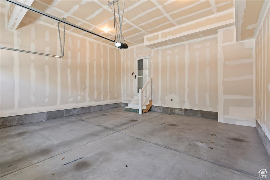 Garage featuring a garage door opener