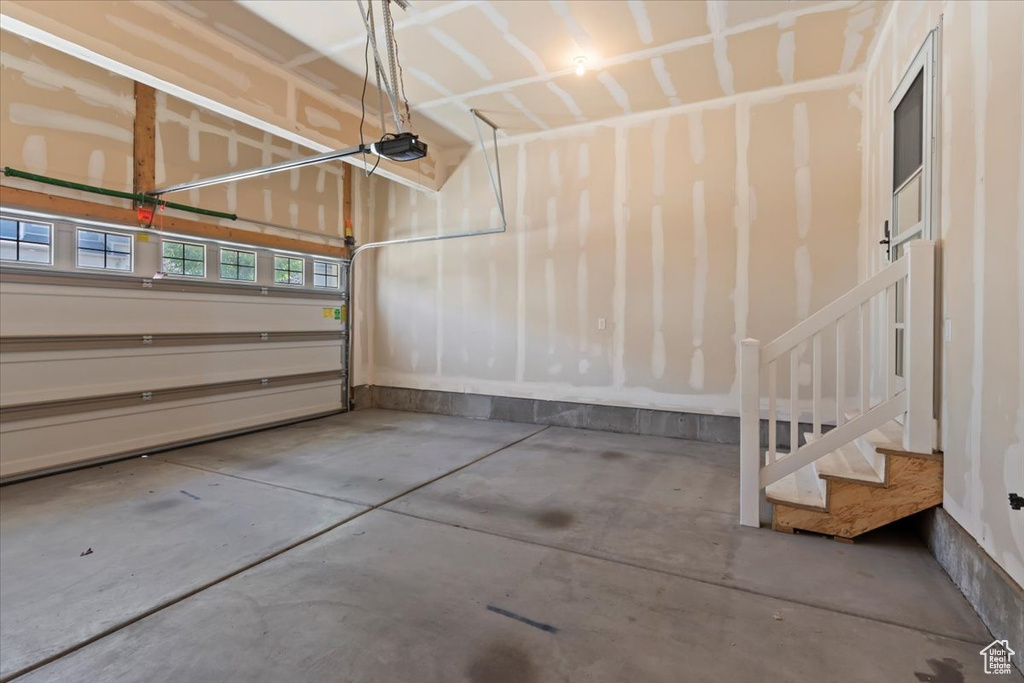 Garage featuring a garage door opener