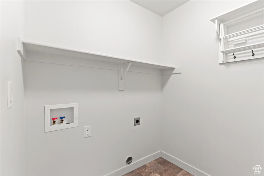 Washroom with hookup for a washing machine and electric dryer hookup