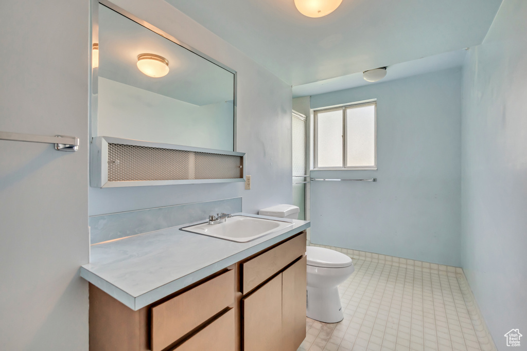 Bathroom featuring vanity and tile patterned floors