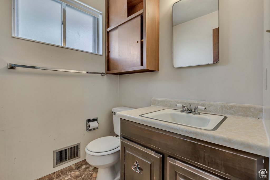 Half bath with toilet and vanity