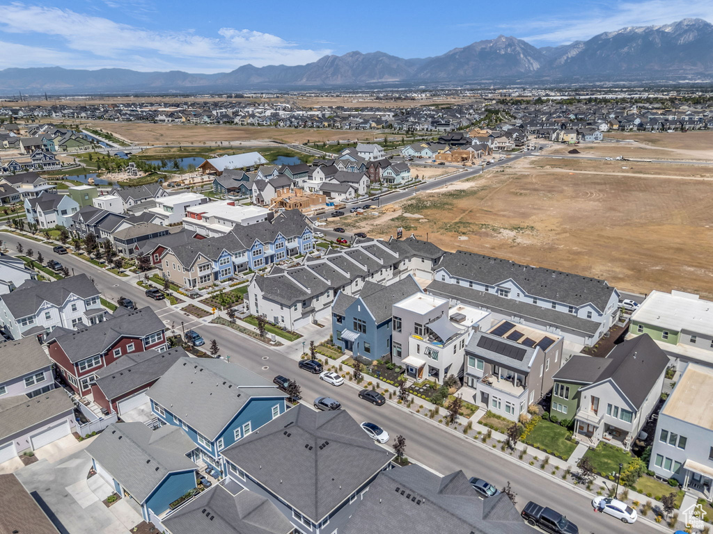 Aerial perspective of suburban area with a water and mountain view