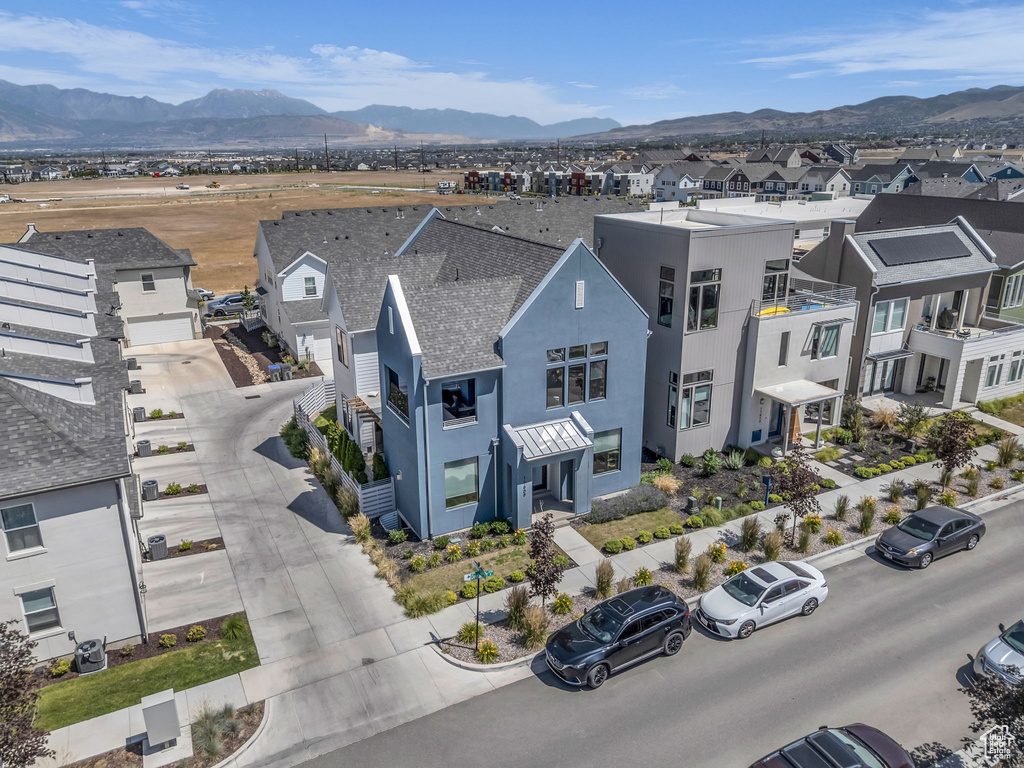 Aerial view of residential area with a mountainous background