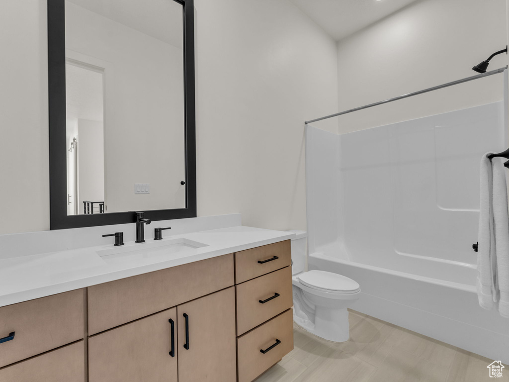 Full bath with vanity and bathtub / shower combination