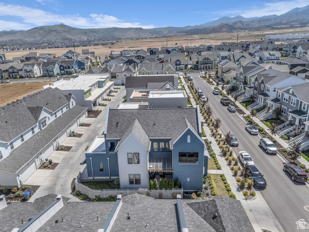 Aerial view of residential area featuring a mountainous background