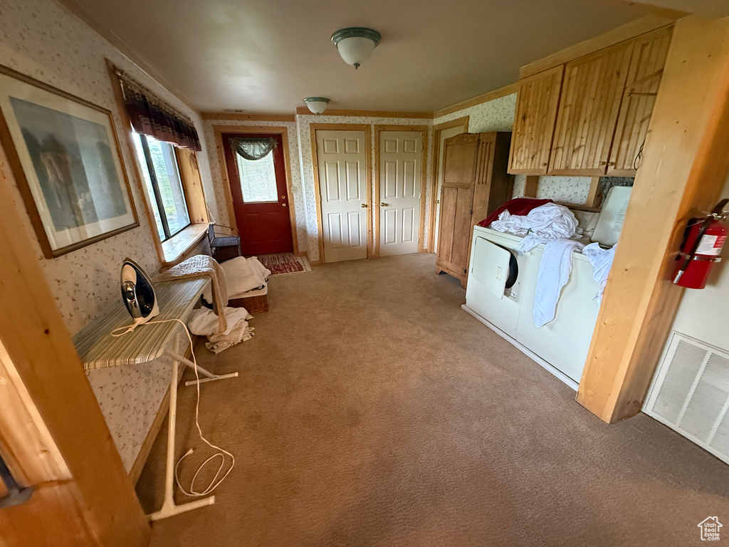 Kitchen featuring wallpapered walls and carpet