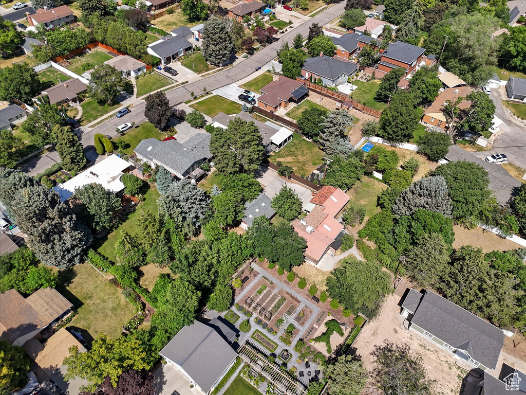 Aerial view of property and surrounding area with nearby suburban area