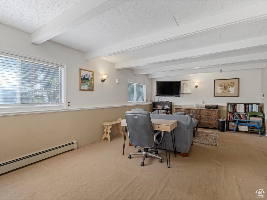 Office featuring carpet flooring, a baseboard radiator, and beam ceiling