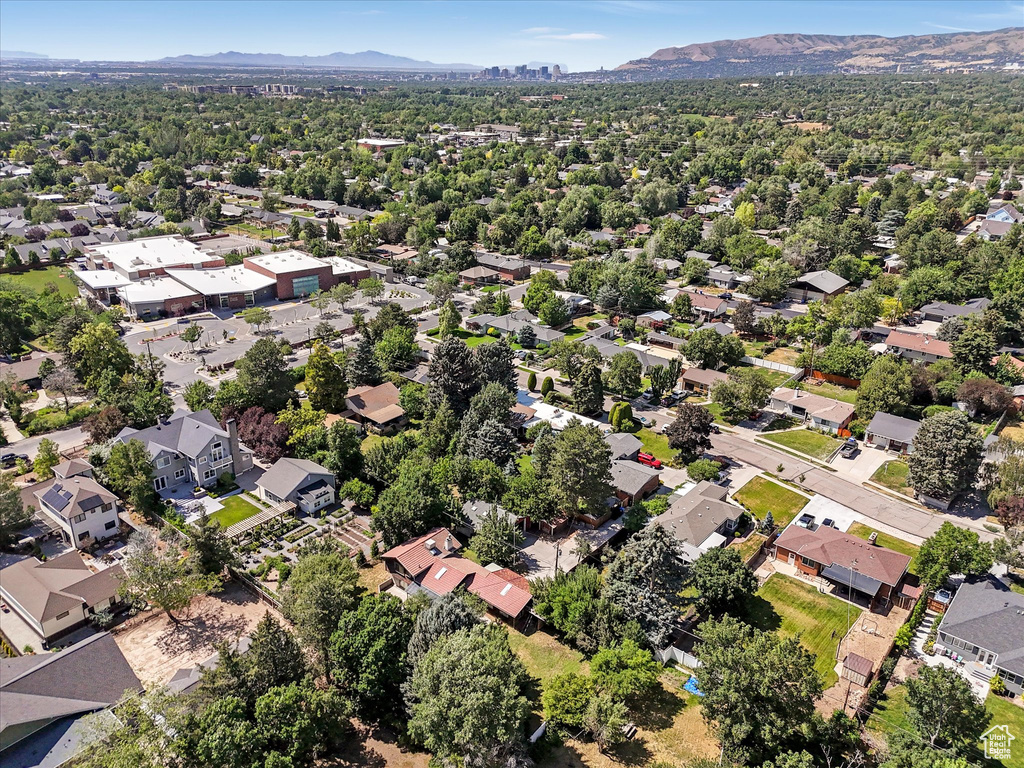Aerial perspective of suburban area featuring a mountainous background