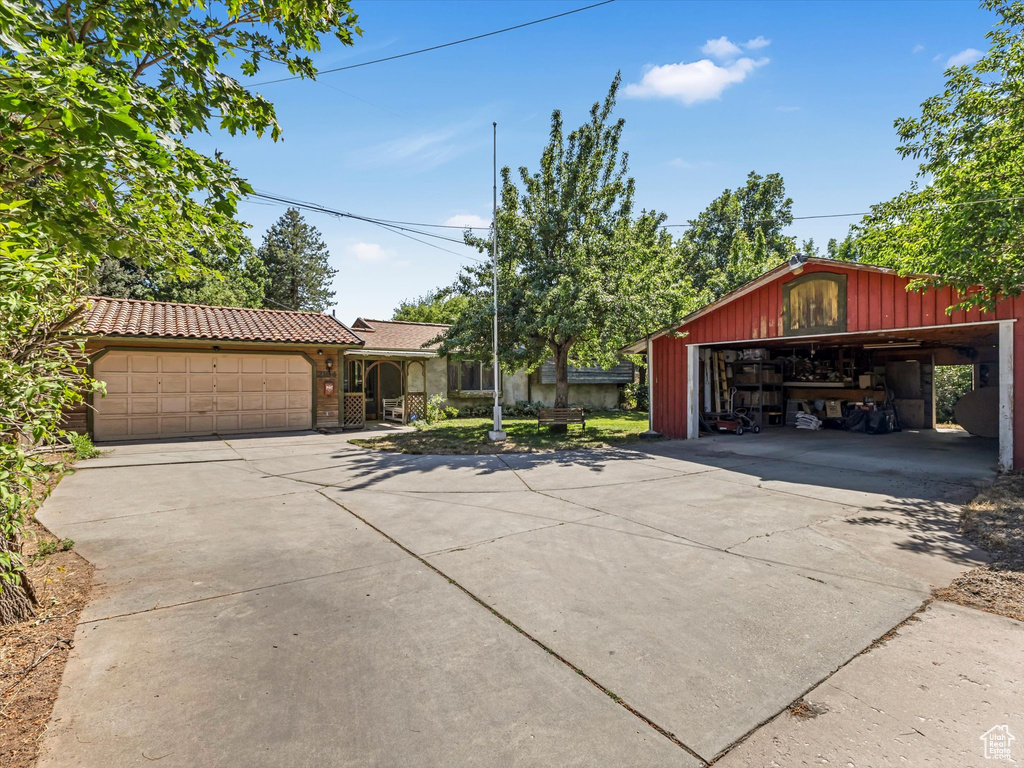 View of front facade featuring concrete driveway