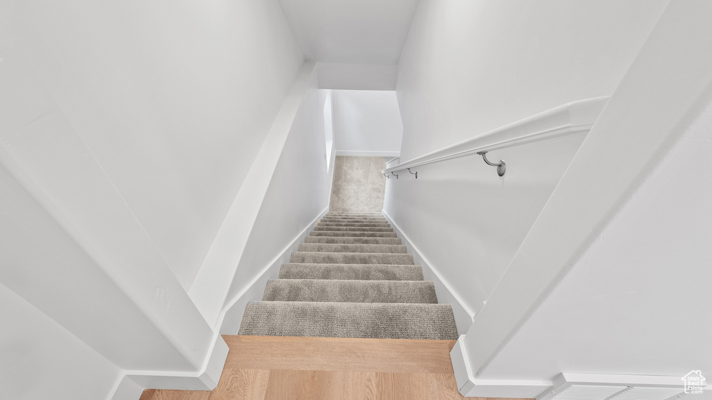Staircase featuring baseboards