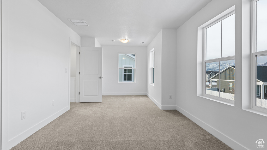 Unfurnished room featuring carpet flooring