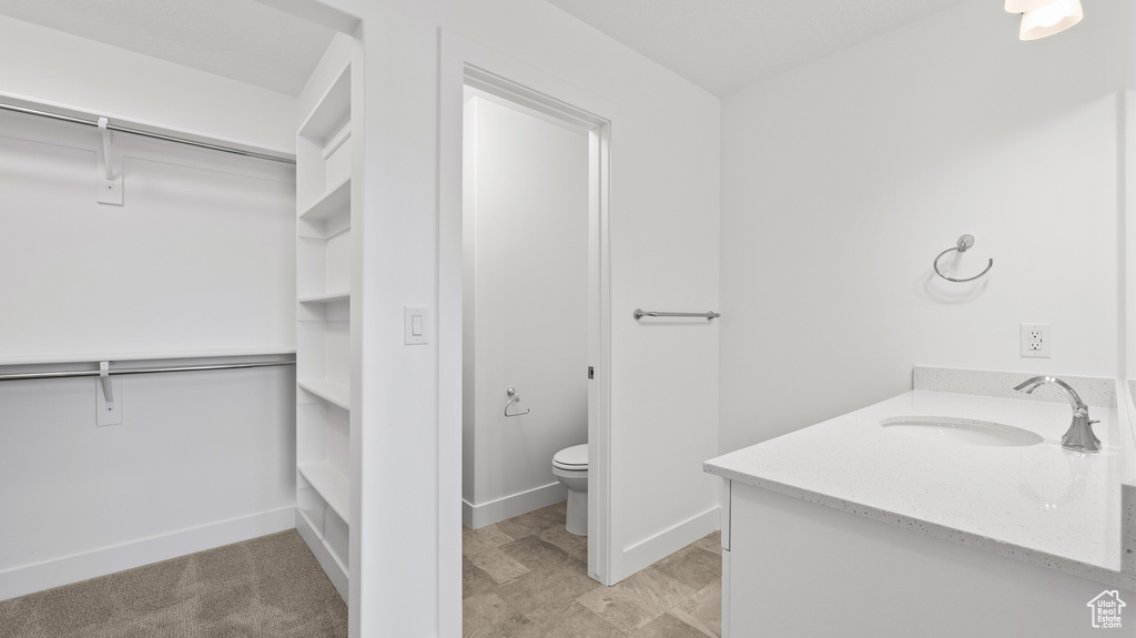 Bathroom with vanity and toilet