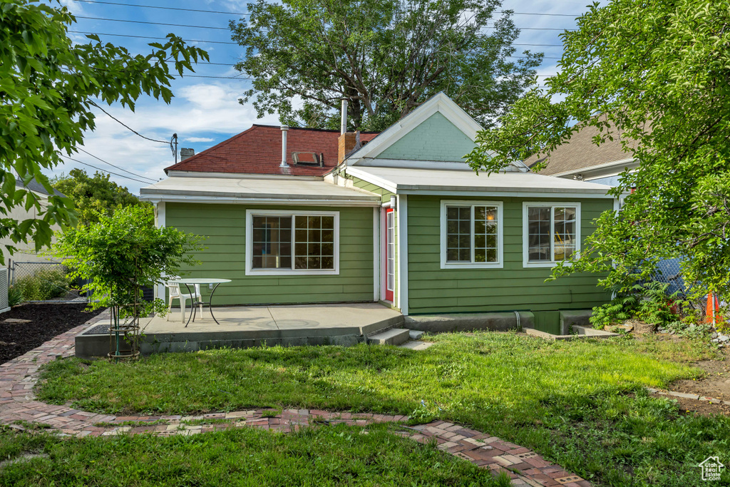 Back of property with a patio area