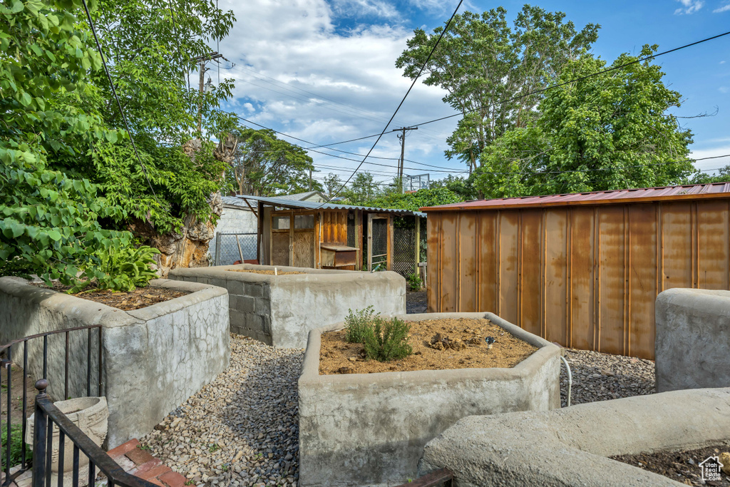 View of patio featuring an outbuilding