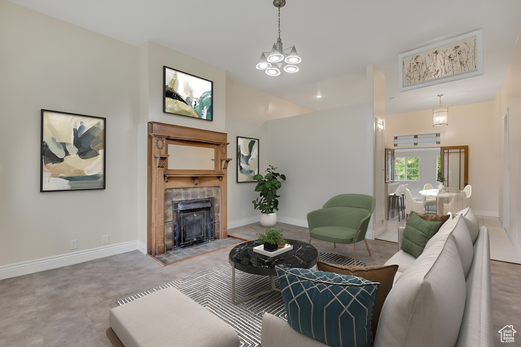 Living area featuring a tile fireplace and concrete floors