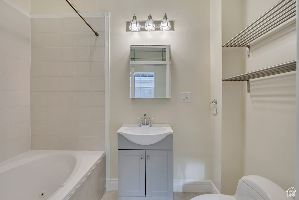 Full bathroom with vanity and bathing tub / shower combination