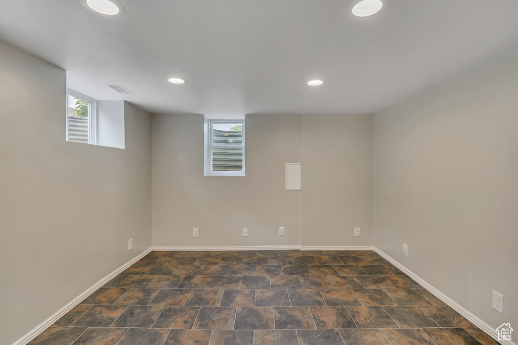 Below grade area featuring recessed lighting and baseboards
