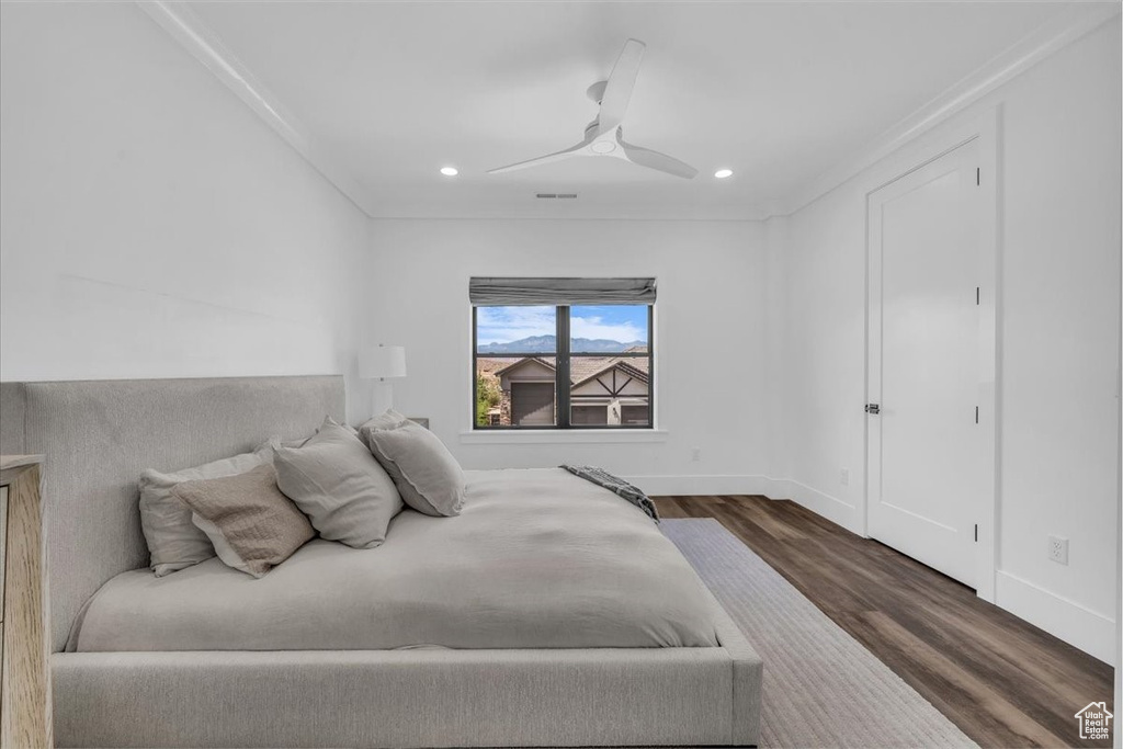 Bedroom with wood finished floors, recessed lighting, a ceiling fan, and ornamental molding