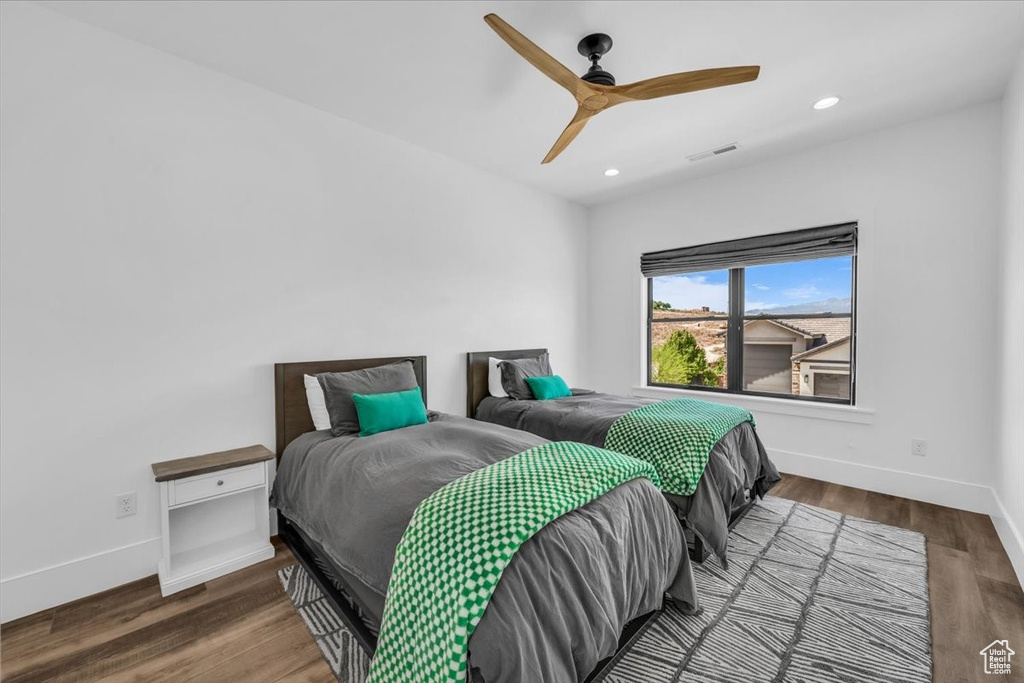 Bedroom featuring recessed lighting, wood finished floors, and ceiling fan