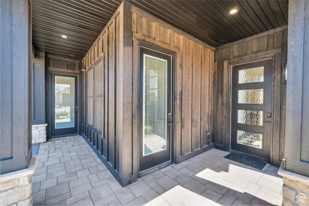 Property entrance with board and batten siding