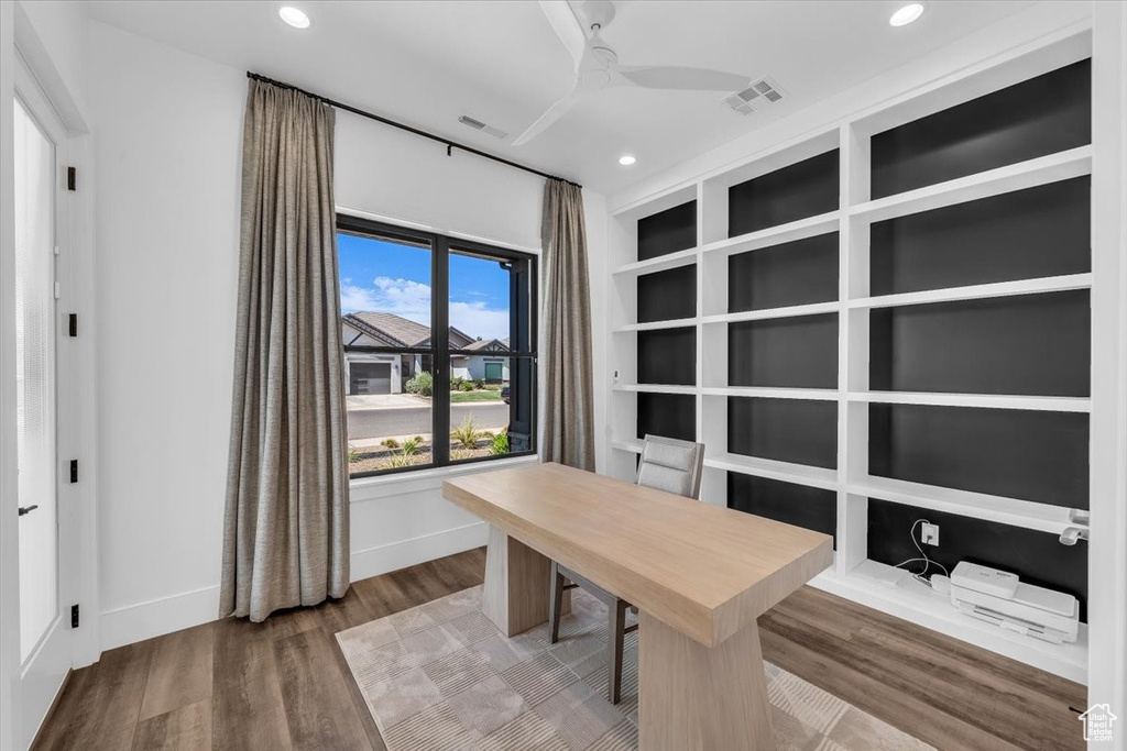 Office area with wood finished floors, a ceiling fan, and recessed lighting