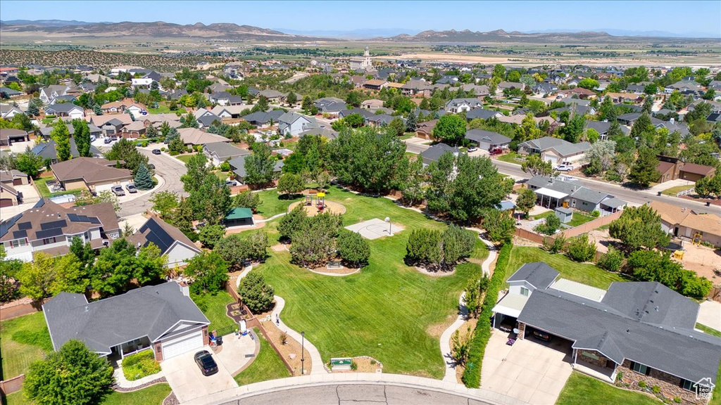 Aerial perspective of suburban area featuring a mountainous background