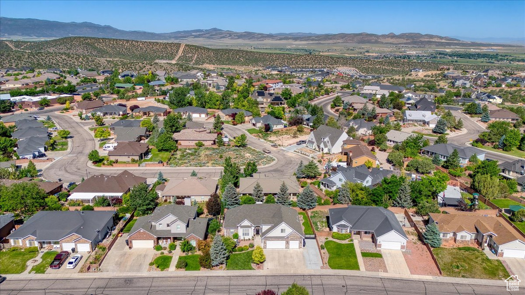 Aerial overview of property\'s location featuring nearby suburban area and mountains