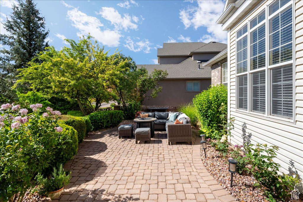 View of patio with an outdoor hangout area