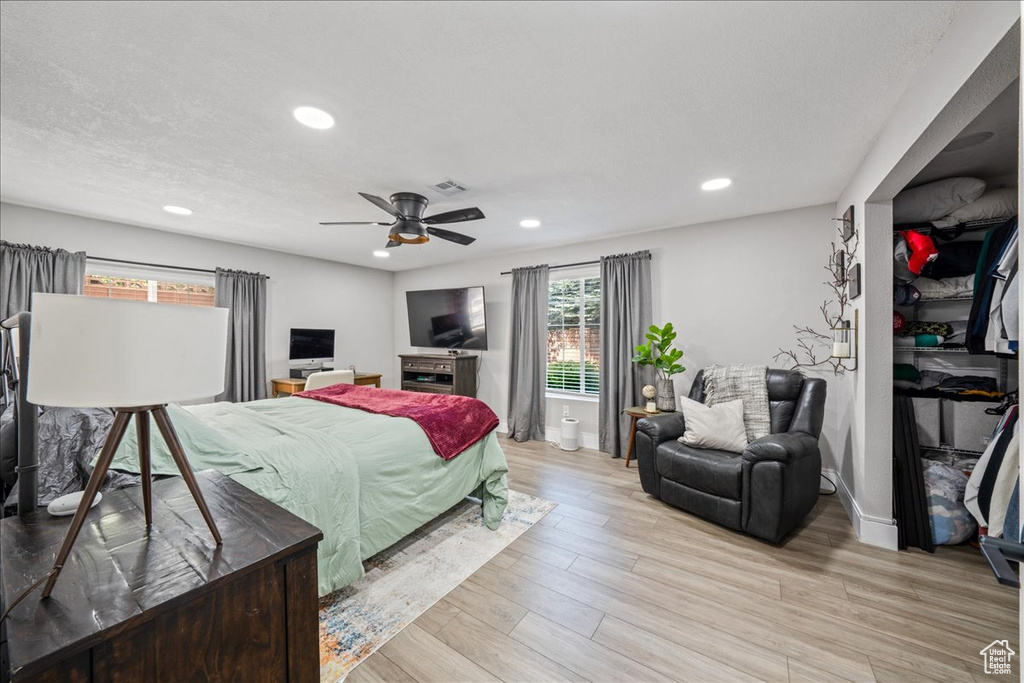 Bedroom featuring recessed lighting, light wood finished floors, and a ceiling fan