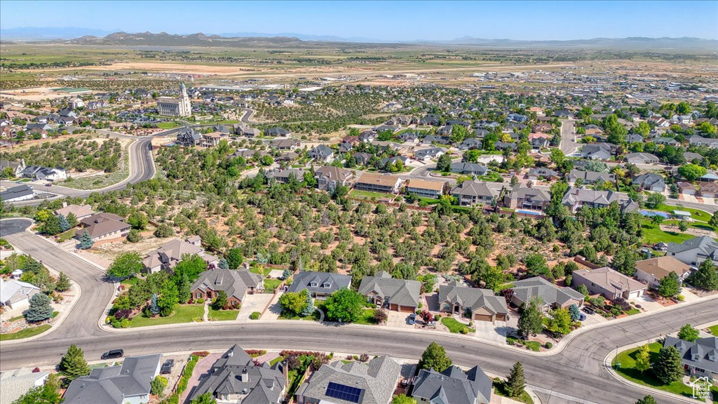 Aerial view of property\'s location with a mountain backdrop and nearby suburban area